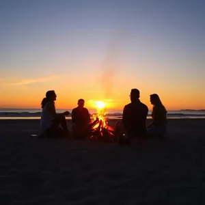 friends around warm glow with sunrise beach bonfire (golden morning sky - good morning friends images) — lovely good morning friends images HD pic