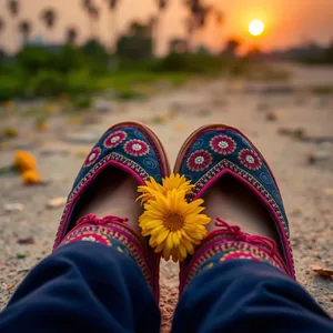 good morning images in punjabi greeting image featuring soothing traditional Punjabi jutti shoes with marigold at sunrise - good morning images in punjabi