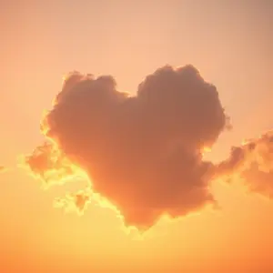 heart-shaped cloud in golden morning sunrise sky, dreamy romantic, warm couple morning photo art