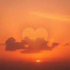warm pink and orange tones with heart-shaped cloud in golden morning sunrise sky (dreamy romantic) for sweet love greeting